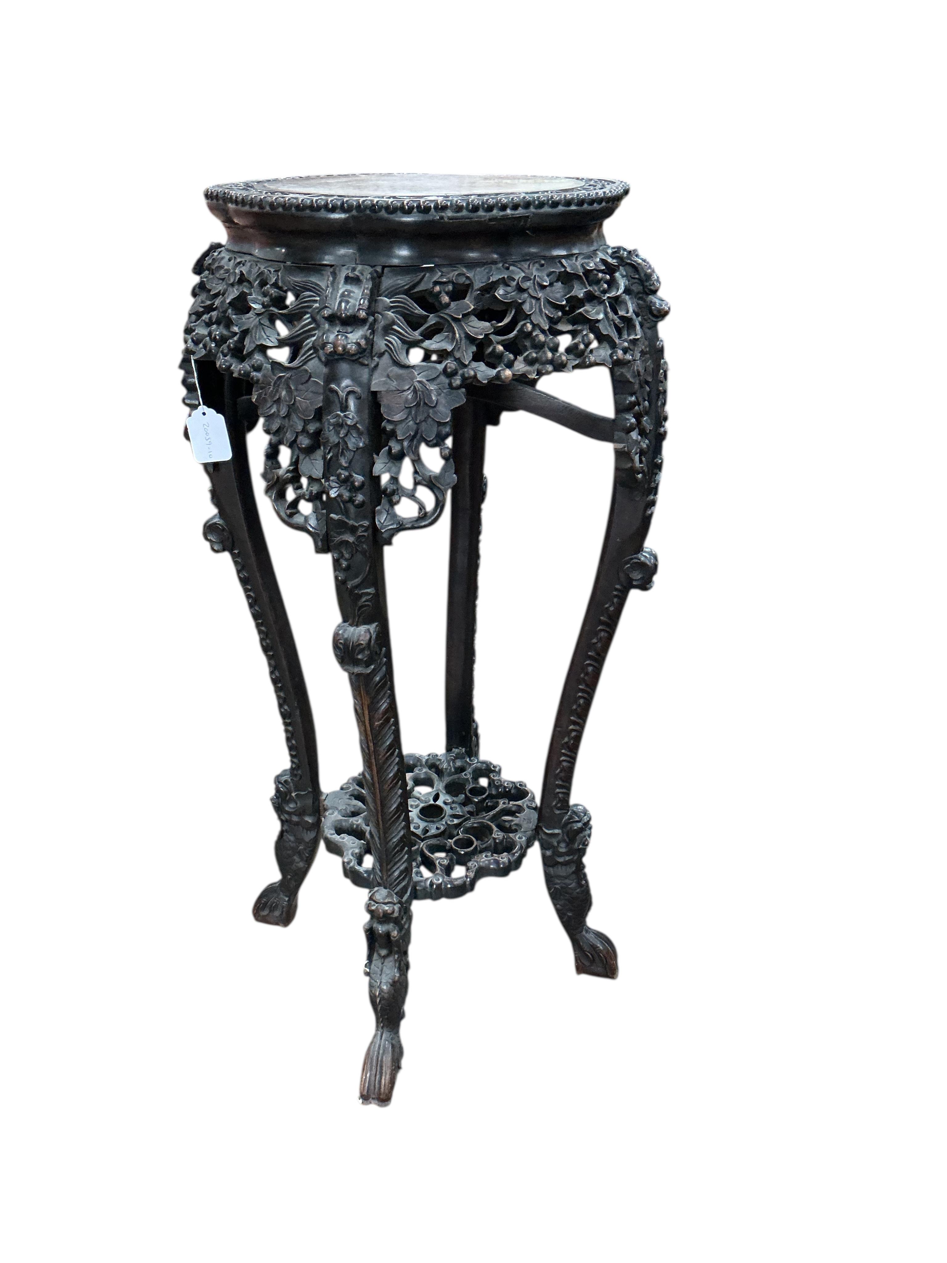 A Chinese carved hongmu rouge marble topped vase stand, diameter 42cm, height 93cm
